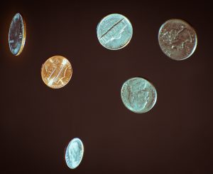 71 Cents in free fall with a black background