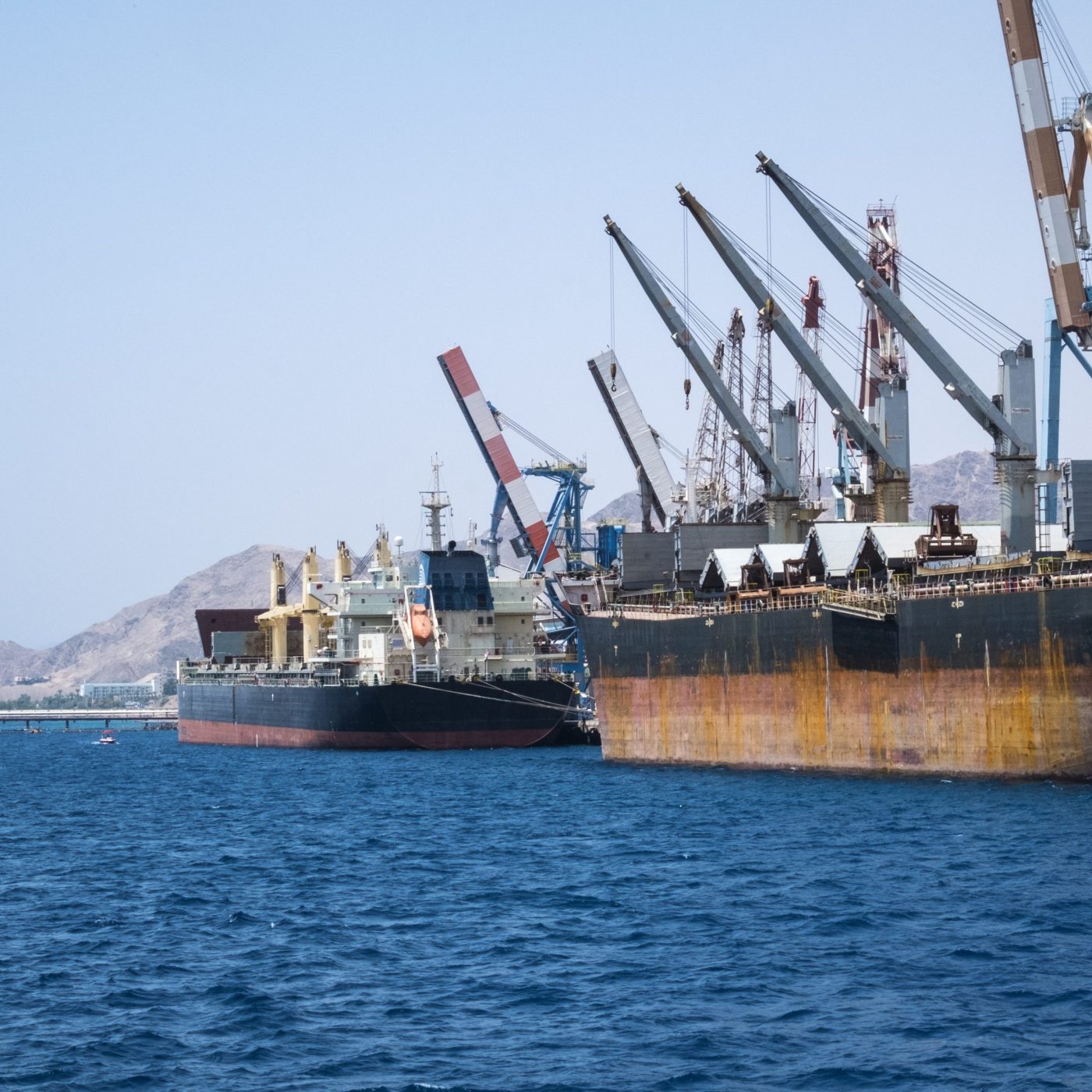 Cargo ships stand in the port of Eilat on the Red Sea (Israel)