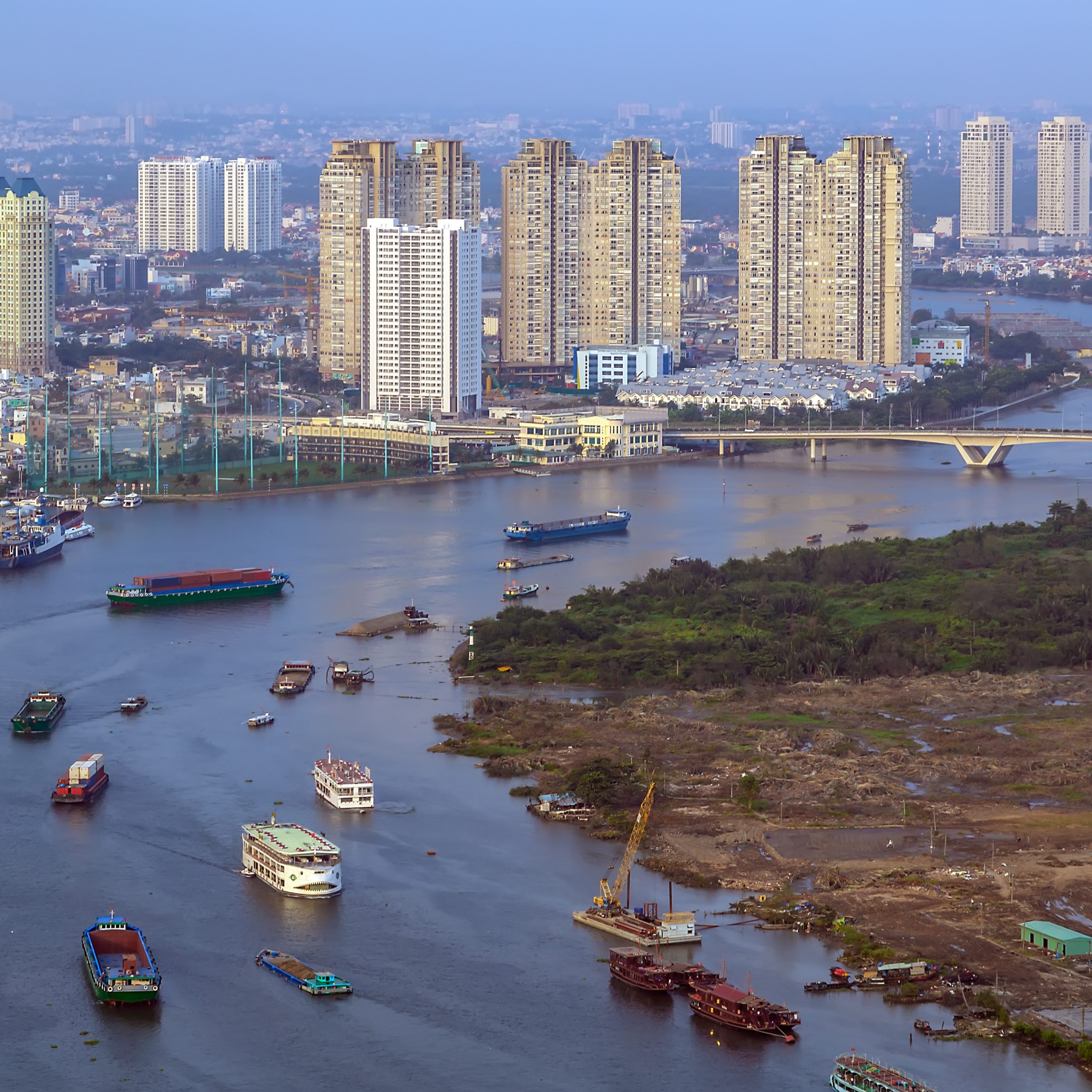 Ho Chi Minh City Aerial view Saigon River with ships scene cityscape skyline, Vietnam. Panoramic wide angle image modern architecture Skyscrapers aerial view landscape