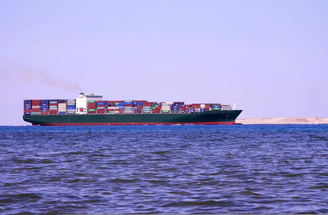 SHARM EL SHEIKH, EGYPT - APRIL 5, 2018 : Red sea, a large cargo ship sails on the sea. High quality photo