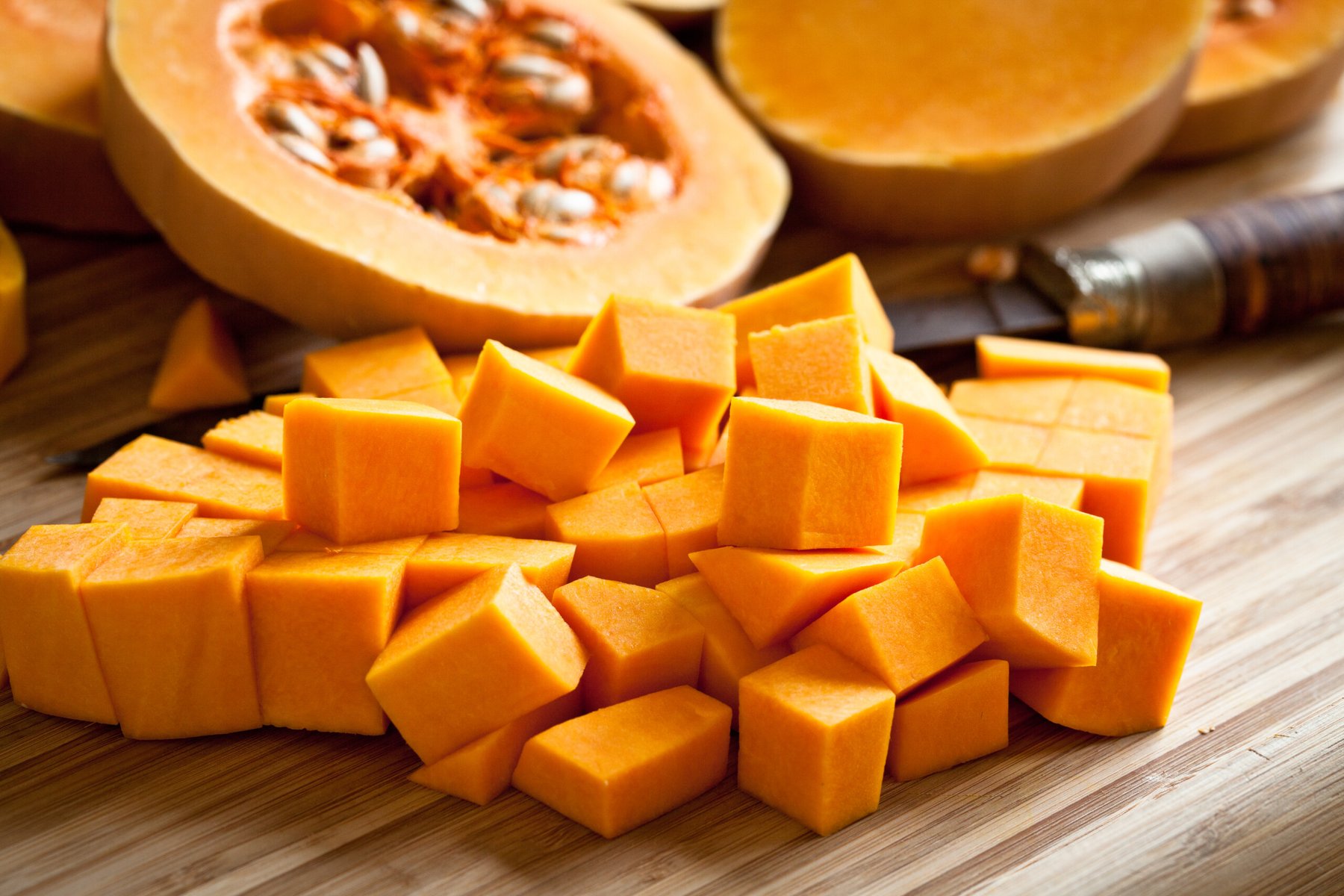 Orange long pumpkin cut into pieces